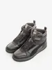 A pair of Puma high-top sneakers on a white background. Produktbild-Vorschau