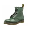 A single green Dr. Martens boot is shown against a white background. Produktbild-Vorschau