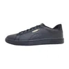 A studio shot of a single black Puma sneaker. Podgląd zdjęcia produktu