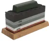 A sharpening stone set with multiple grit levels on a wooden base, with a polishing compound bar on top. Podgląd zdjęcia produktu