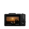 The back of a black digital camera is shown, displaying a sunset scene on its screen. The camera has various buttons on its right side. Produktbild-Vorschau