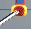 A close-up view of a screwdriver tip engaging with a red gear mechanism within a yellow housing. Produktbild-Vorschau