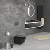 A modern bathroom with a concrete-style wall, featuring a black wall-hung toilet, a vanity with a black sink, and a black radiator. Podgląd zdjęcia produktu