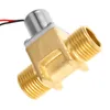 A close-up studio shot of a brass solenoid valve with electrical wires. Produktbild-Vorschau