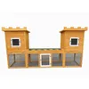 A wooden rabbit hutch designed to look like a castle, shown against a white background. Produktbild-Vorschau