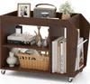 A wooden rolling cart with books, vases, and decorative items on its shelves. Anteprima dell’immagine prodotto
