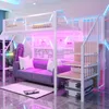 A modern bedroom setup with a loft bed, sofa, and gaming chair, illuminated by pink and blue LED lights. Náhled obrázku produktu