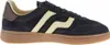A side view of a single navy blue sneaker with cream-colored stripes and a brown heel accent. Anteprima dell’immagine prodotto