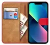 A book-style phone case with a phone, cards, and cash inside. Podgląd zdjęcia produktu