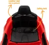 Close-up view of the interior of a red electric toy car, showing the seat and safety belt. Voir les images du produit