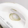Close-up of a white iron with beige accents. Produktbild-Vorschau
