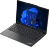 A black Lenovo ThinkPad E14 Gen 6 laptop is shown from a diagonal, slightly elevated front-left perspective. The laptop is open, displaying its screen which shows the Windows 11 operating system with a blue abstract wallpaper and an open application window Produktbild-Vorschau