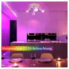 A modern kitchen and dining area with colorful lighting. Produktbild-Vorschau