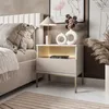 A bedroom scene featuring a nightstand next to a bed. Produktbild-Vorschau