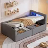 A bedroom scene featuring a grey upholstered bed with storage drawers and LED lighting. Produktbild-Vorschau