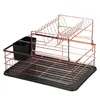 A two-tier dish drying rack with a black tray and utensil holder, made of copper-colored metal. Anteprima dell’immagine prodotto