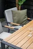 An outdoor dining set with chairs and a table, featuring a glass of drink on the table. Produktbild-Vorschau