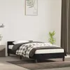 A bedroom scene with a black bed frame and bedding. Anteprima dell’immagine prodotto