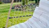 Close-up of a hanging chair with cushions outdoors. Podgląd zdjęcia produktu