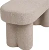 A close-up view of a beige upholstered bench with a unique, sculptural base. Podgląd zdjęcia produktu