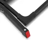 A close-up view of the black metal frame of a folding step stool, showing the joint and a red rubber foot. Podgląd zdjęcia produktu
