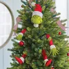 A Christmas tree decorated with Grinch-themed ornaments. Produktbild-Vorschau