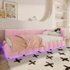 A pink upholstered daybed with LED lighting in a bedroom setting. Náhled obrázku produktu