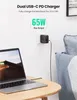 A dual USB-C PD charger is plugged into a wall outlet and charging a MacBook Pro. Anteprima dell’immagine prodotto