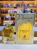 A perfume bottle and its box are displayed on a textured surface, with shelves of other perfumes in the background. Produktbild-Vorschau