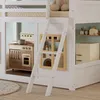 A close-up view of a white wooden bunk bed with a play kitchen and a toy refrigerator integrated into the design. Produktbild-Vorschau