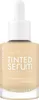 A bottle of Catrice Nude Drop Tinted Serum Foundation. Produktbild-Vorschau