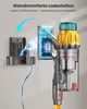 A vacuum cleaner is shown charging on a wall-mounted charging station, with graphics illustrating the charging process. Produktbild-Vorschau