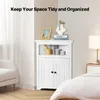 A white corner cabinet is shown in a bedroom setting, with a bed and chair visible. Anteprima dell’immagine prodotto