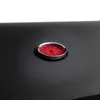 A close-up view of a thermometer on a black surface. Produktbild-Vorschau