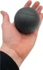 A hand holding a dark gray ball. Náhľad obrázku produktu
