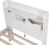 A close-up view of the headboard of a white bed frame, showing storage compartments and drawers. Podgląd zdjęcia produktu