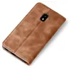 A brown leather flip case for a smartphone is shown against a white background. Produktbild-Vorschau