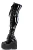 A single black patent leather boot with a platform sole and lace-up front, shown against a white background. Produktbild-Vorschau