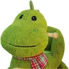 A close-up of a plush green dinosaur toy with a red and white plaid scarf. Produktbild-Vorschau