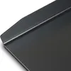 A close-up view of the corner of a black grill plate. Náhľad obrázku produktu