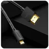 A close-up shot of a black HDMI cable with gold connectors against a dark, abstract background. Produktbild-Vorschau