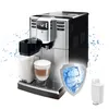 A coffee machine with a milk carafe and a cup of coffee, surrounded by water splashes, with a shield graphic and a water filter. Náhled obrázku produktu