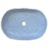 A top-down view of a blue speckled ceramic sink with a drain hole in the center. Produktbild-Vorschau