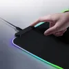 A hand is touching a gaming mousepad with RGB lighting. Produktbild-Vorschau