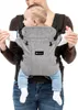 A baby is being held in a baby carrier by an adult. Podgląd zdjęcia produktu