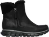 A black Skechers boot with a faux fur lining and a zipper closure, shown from the side against a white background. Voir les images du produit
