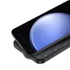 A close-up, angled view of a black smartphone case with a carbon fiber-like texture, showing the edge and part of the screen. Produktbild-Vorschau