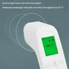 Close-up of a white infrared thermometer with a green screen displaying a temperature reading. Produktbild-Vorschau