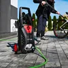 A person is using a pressure washer to clean a bicycle outdoors on a paved patio. Podgląd zdjęcia produktu