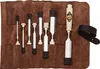 A set of chisels laid out in a brown leather roll. Anteprima dell’immagine prodotto